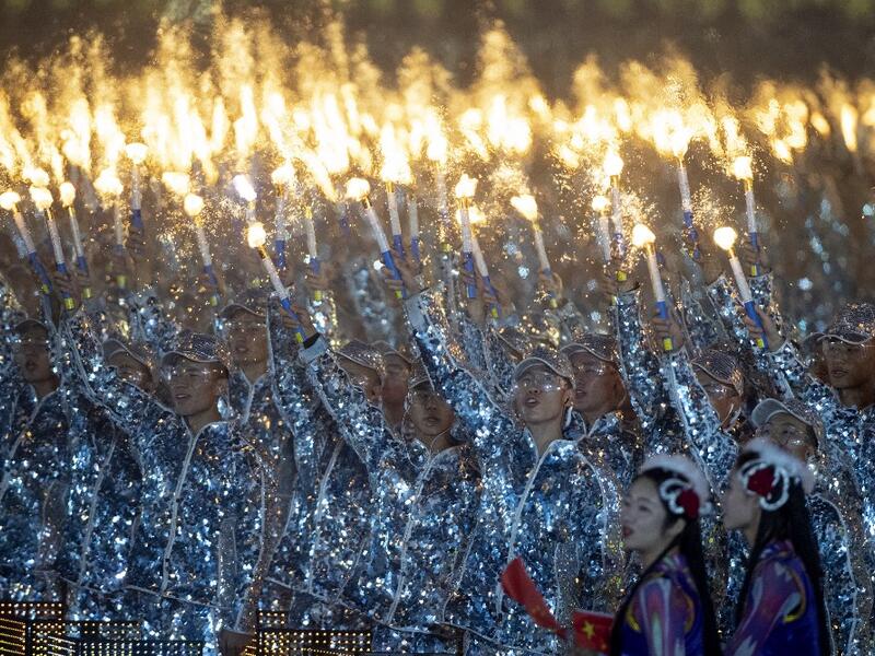Chinese performers dance at a gala in Tiananmen Square in Beijing on October 1, 2019, to mark the 70th anniversary of the founding of the People’s Republic of China. NOEL CELIS / AFP