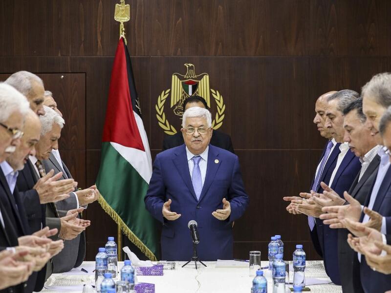 Palestinian president Mahmud Abbas (C) recites the Fatiha prayer before chairing a meeting of the central committee of the Fatah movement in the West Bank city of Ramallah on October 1, 2019. ABBAS MOMANI / AFP