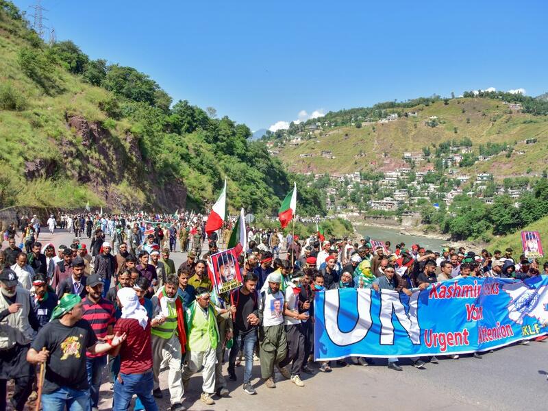Kashmiri people march towards the border town of Chokathi to protest against the Indian government lockdown of Indian-controlled Kashmir, in Muzaffarabad on October 5, 2019. (AFP/ File Photo)