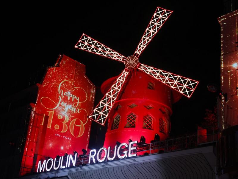 This picture taken on October 6, 2019 shows Moulin Rouge logo during the celebration of the 130th anniversary of the French oldest cabaret, in Paris.  GEOFFROY VAN DER HASSELT / AFP