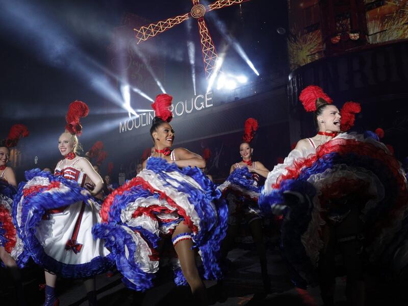 Moulin Rouge dancers perform during the celebration of the 130th anniversary of the French oldest cabaret, on October 6, 2019 in Paris.  GEOFFROY VAN DER HASSELT / AFP