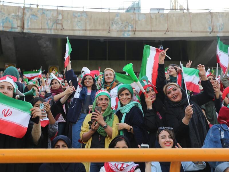 The Islamic republic has barred female spectators from football and other stadiums for around 40 years, with clerics arguing they must be shielded from the masculine atmosphere and sight of semi-clad men. Women fans are attending the football match freely for the first time in decades, after FIFA threatened to suspend the country over its controversial male-only policy.  ATTA KENARE / AFP