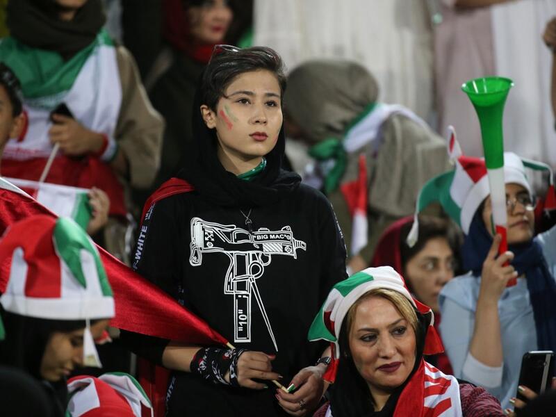 Iranian women look on during the World Cup Qatar 2022 Group C qualification football match between Iran and Cambodia at the Azadi stadium in the capital Tehran on October 10, 2019. ATTA KENARE / AFP
