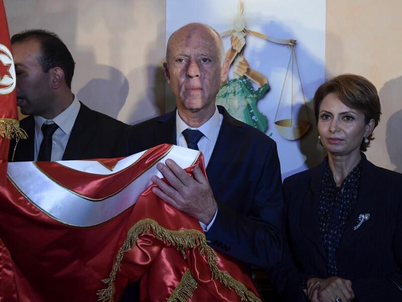 Saied won a landslide victory in Tunisia's presidential runoff, sweeping aside his rival, media magnate Nabil Karoui, state television Wataniya said. It said he scooped almost 77 percent of the vote, compared to 23 percent for Karoui. Fethi Belaid / AFP