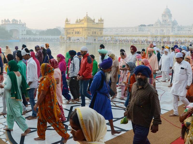Sikh devotees visit the Golden Temple to mark Bandi Chhor Divas which coincides with the day of Diwali in Amritsar on October 27, 2019. Sikhs celebrate Bandi Chhor Divas on the same day as the Hindu festival of Diwali, to mark the historic return of the sixth Guru Hargobind. NARINDER NANU / AFP