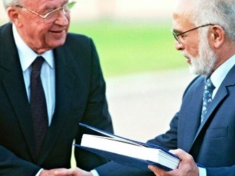A file photo taken on November 10, 1994, shows Jordan's King Hussein (R) and Israeli Premier Yitzhak Rabin shake hands after exchanging the documents of the Peace Treaty  (AFP File)