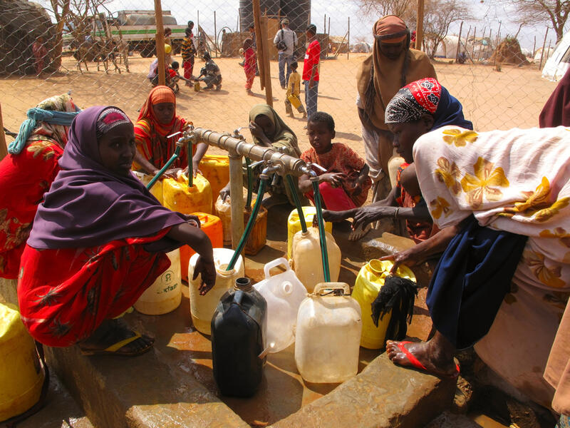 men, women & children wait for relief aid in the Dadaab refugee camp where thousands of Somalis end up due to hunger. (Shutterstock/ File Photo)