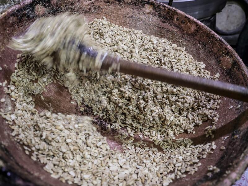 Peanuts are mixed eith melted sugar to make sweets at a candy factory in the capital Cairo on November 2, 2019, ahead of celebrations of the Muslim Prophet Mohammed's birthday, known as "Al Mawlid Al Nabawi". Prophet Mohamed was born in Saudi Arabia's arid mountainous city of Mecca, the holiest in Islam, some 1490 years ago. Sunni Muslims in many parts of the world celebrate his birthday on the 12th day of the third month of the Islamic calendar, which will fall this year on November 9th.  Mohamed el-Shahed