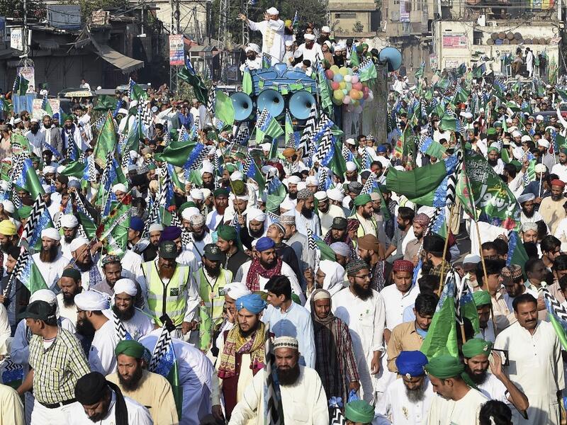 Muslim devotees take part of a procession to celebrate the birthday of Prophet Mohammed, in Lahore on November 10, 2019. The birthday of Prophet Mohammed, also known as 'Milad', is celebrated during the Islamic month of Rabi al-Awwal, which falls on 12 Rabi al-Awwal in Islamic calendar. Arif ALI / AFP