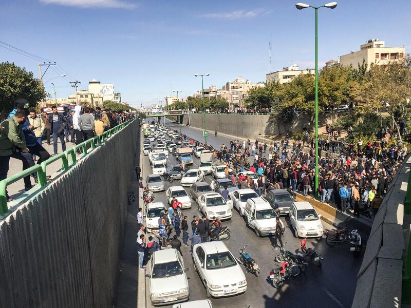 Iranian protesters block a road during a demonstration against an increase in gasoline prices in the central city of Isfahan, on November 16, 2019. One person was killed and others injured in protests across Iran. (AFP)
