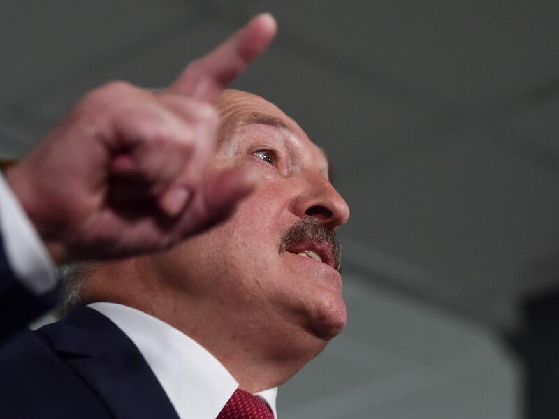 Belarus' President Alexander Lukashenko speaks with journalists as he votes at a polling station during Belarus' parliamentary election in Minsk on November 17, 2019. Sergei GAPON / AFP