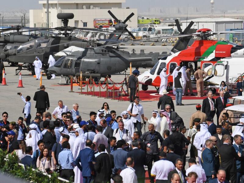 People attend the Dubai Airshow on November 18, 2019. KARIM SAHIB / AFP