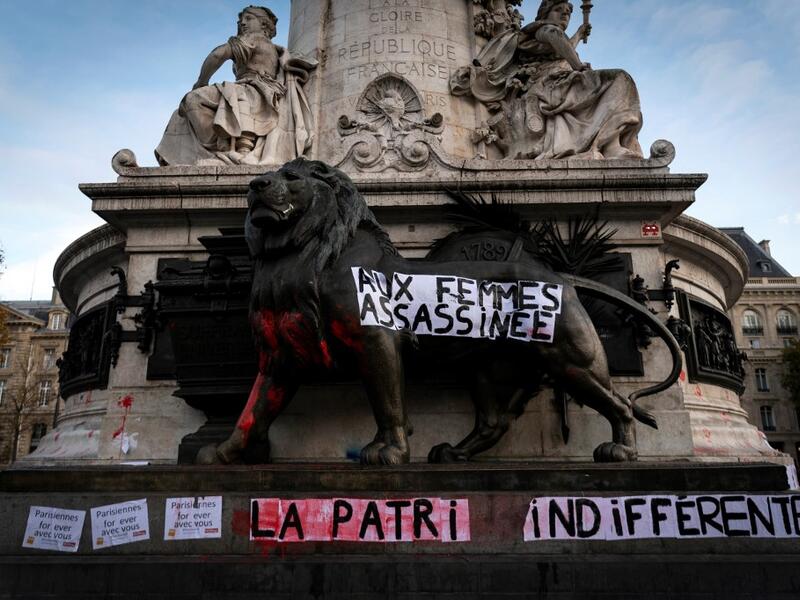 A banner dedicated to the memory of women killed by a current or former partner, and against violence towards women, hangs on the monument of the Republic square on November 25, 2019 in Paris, on the International Day for Eliminating Violence against Women.LIONEL BONAVENTURE / AFP