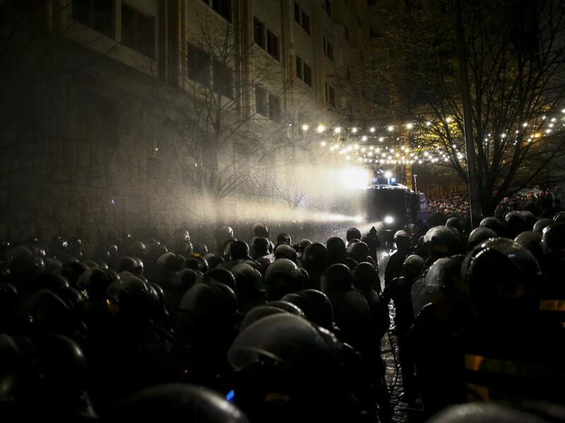 Riot police use a water cannon against protesters demanding the government's resignation and early parliamentary polls outside the parliament in Tbilisi on November 26, 2019. Zurab Tsertsvadze / AFP