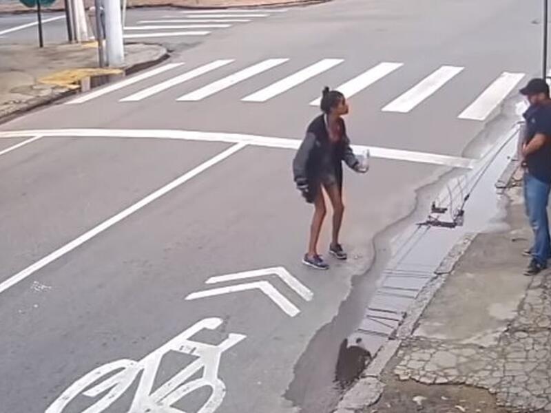 Dos Santos Leandro (center) apparently argued with de Castro (right) before he reached for a gun and shot her dead. (Video Screenshot)