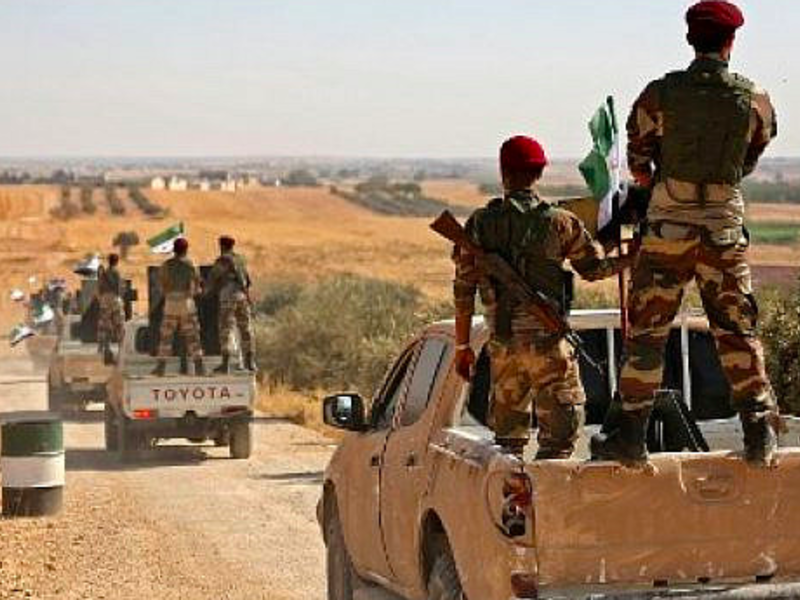 Turkish-backed Syrian rebel fighters head to an area near the Syrian-Turkish border north of Aleppo on October 8, 2019 (Nazeer Al-khatib / AFP)