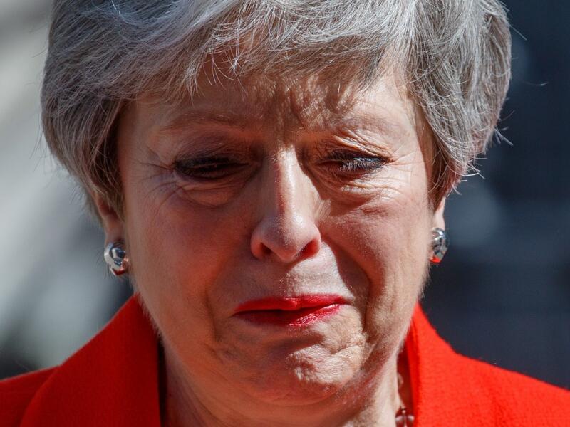 Britain's Prime Minister Theresa May reacts as she announces her resignation outside 10 Downing street in central London on May 24, 2019. Beleaguered British Prime Minister Theresa May announced on Friday that she will resign on June 7, 2019 following a Conservative Party mutiny over her remaining in power. Tolga AKMEN / AFP