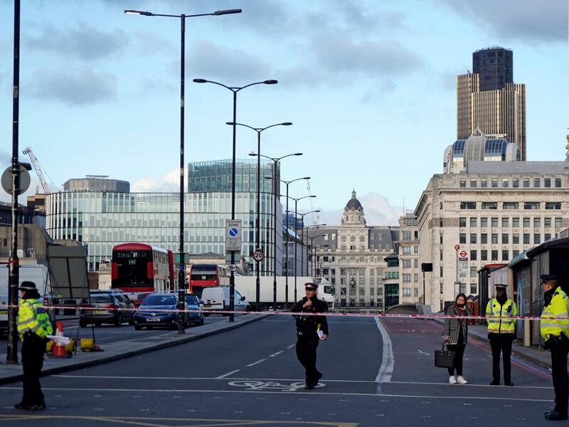 British police officers stand on duty at the southern entrance to London Bridge, leading to the City of London, on November 30, 2019, following the November 29 terror incident in which two people died after being stabbed on the bridge. (AFP/ File Photo)