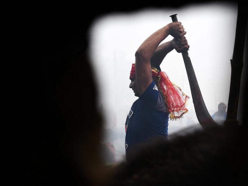 A Hindu devotee slaughters a buffalos as a offering during the Gadhimai Festival in Bariyarpur on December 3, 2019. Thousands of Hindu devotees gathered in southern Nepal for a festival believed to be the world's biggest ritual animal slaughter, despite court orders and calls by animal activists to end the event. The sacrifices take place every five years in Bariyarpur village close to the Indian border, in honour of the Hindu goddess of power. Prakash MATHEMA / AFP