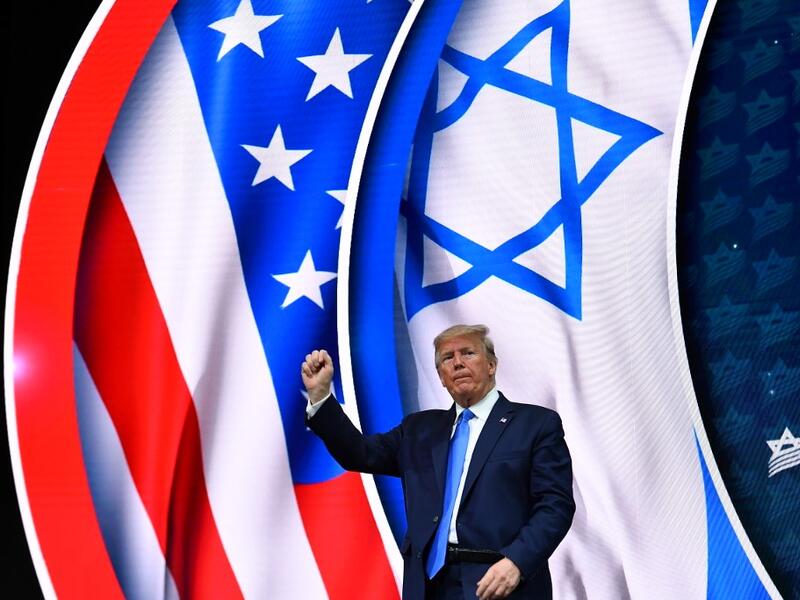 US President Donald Trump stands on stage after his address to the Israeli American Council National Summit 2019 at the Diplomat Beach Resort in Hollywood, Florida on December 7, 2019. MANDEL NGAN / AFP