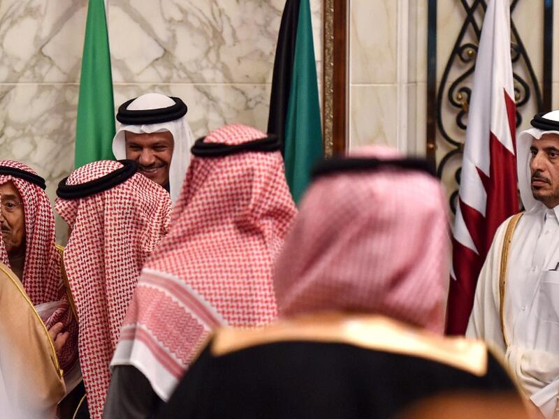Abdullah bin Nasser bin Khalifa al-Thani (R), Qatar's Prime Minister, looks on as other delegates of the Gulf Cooperation Council (GCC) summit chat with each other, in the Saudi capital Riyadh on December 10, 2019. Fayez Nureldine / AFP