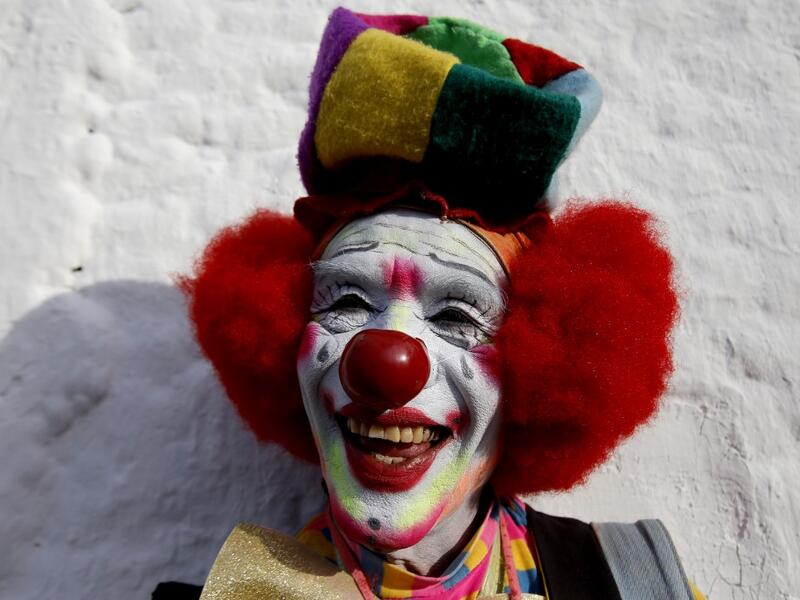 A clown pose for a picture during the International Clown Day in Guadalajara, Mexico, on December 10, 2019. Ulises Ruiz / AFP