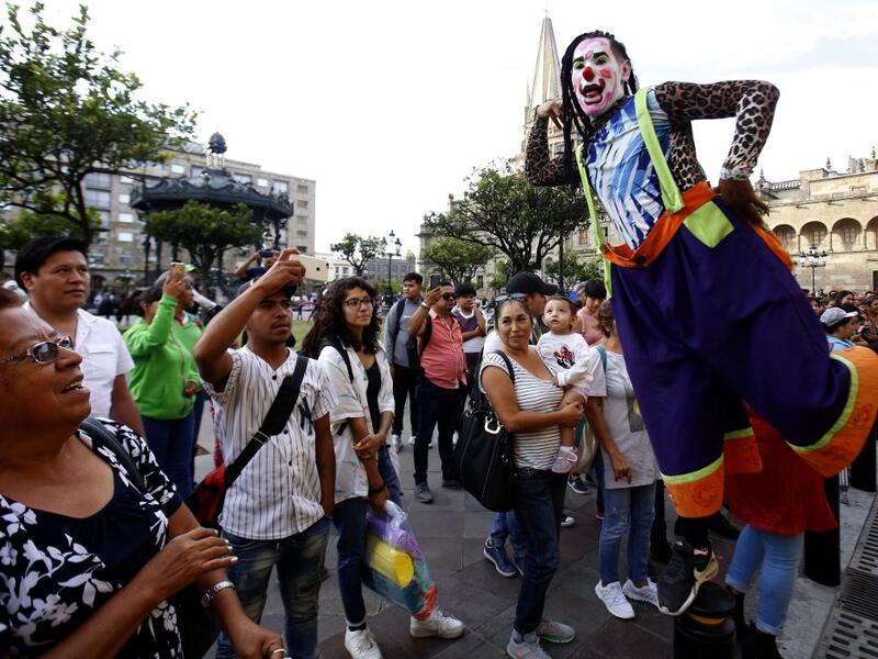 A group of clowns play during the International Clown Day in Guadalajara, Mexico, on December 10, 2019. Ulises Ruiz / AFP