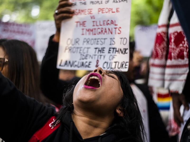 Protesters shout slogans during a demonstration against the Indian government's Citizenship Amendment Bill in New Delhi on December 14, 2019. Protests against a divisive new citizenship law raged on December 14 as Washington and London issued travel warnings for northeast India following days of violent clashes that have killed two people so far. Jewel SAMAD / AFP