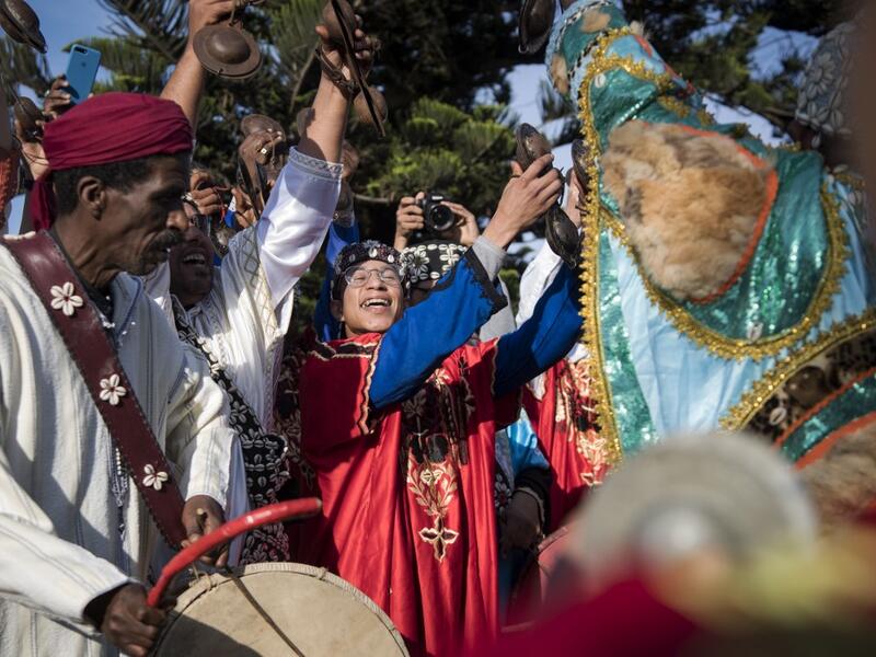 Often dressed in colourful outfits, Gnawa musicians play the guenbri, a type of lute with three strings, accompanied by steel castanets called krakebs. FADEL SENNA / AFP