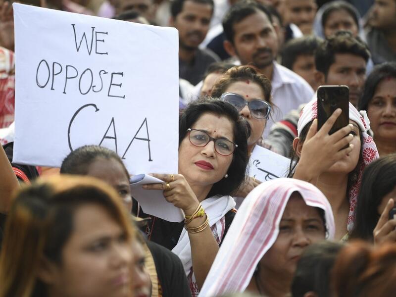 Demonstrators take part in a musical concert to protest against the Indian government's Citizenship Amendment Bill (CAB) in Guwahati on December 15, 2019. Some 5,000 people took part in a fresh demonstration in Guwahati on December 15, with hundreds of police watching on as they sang, chanted and carried banners with the words "long live Assam". Sajjad HUSSAIN / AFP