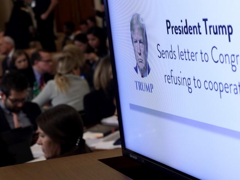 A graphic indicating U.S. President Donald Trump's refusal to cooperate with congressional investigators is shown on a monitor as constitutional scholars Noah Feldman of Harvard University, Pamela Karlan of Stanford University, Michael Gerhardt of the University of North Carolina, and Jonathan Turley of George Washington University testify before the House Judiciary Committee in the Longworth House Office Building on Capitol Hill December 4, 2019 in Washington, DC.  (AFP/ File Photo)