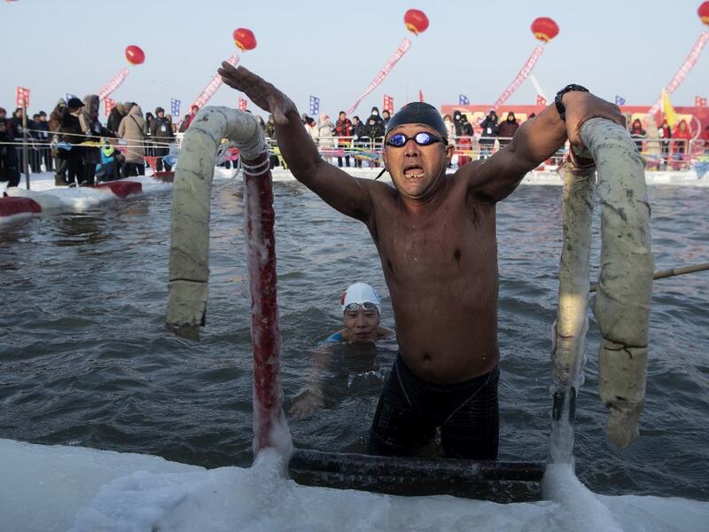 A swimmer participates in the winter swimming competition ahead of the opening of the Harbin International Ice and Snow Festival in Harbin, China's northeast Heilongjiang province on January 5, 2020. Noel CELIS / AFP