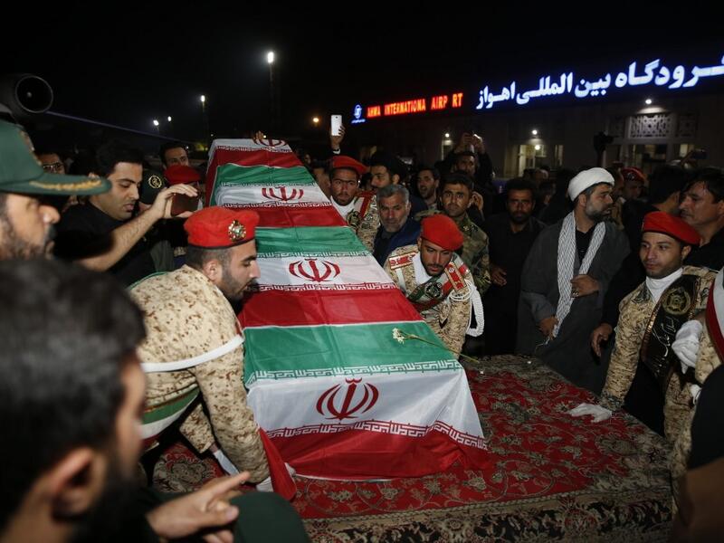 Military personnel carry the casket of Iranian commander Qasem Soleimani upon arrival at Ahvaz International Airport in Tehran on January 5, 2020. A tide of mourners packed the streets of the Iranian city of Ahvaz Sunday to pay respects to top general Qasem Soleimani, days after he was killed in a US strike. HOSSEIN MERSADI / fars news / AFP