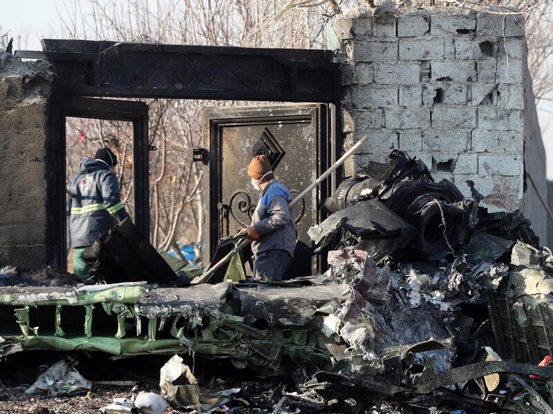 Rescue teams work at the scene after a Ukrainian plane carrying 176 passengers crashed near Imam Khomeini airport in the Iranian capital Tehran early in the morning on January 8, 2020, killing everyone on board. All 176 people on board a Ukrainian passenger plane were killed when it crashed shortly after taking off from Tehran on January 8, Iranian state media reported. State news agency IRNA said 167 passengers and nine crew members were on board the aircraft operated by Ukraine International Airlines. AFP