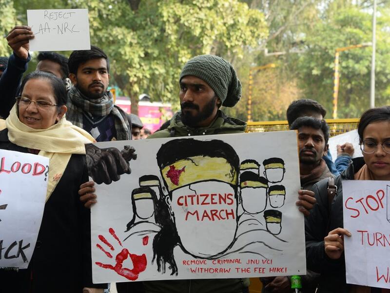 Protesters hold placards at a demonstration against India's new citizenship law in New Delhi on January 9, 2020. Sajjad HUSSAIN / AFP