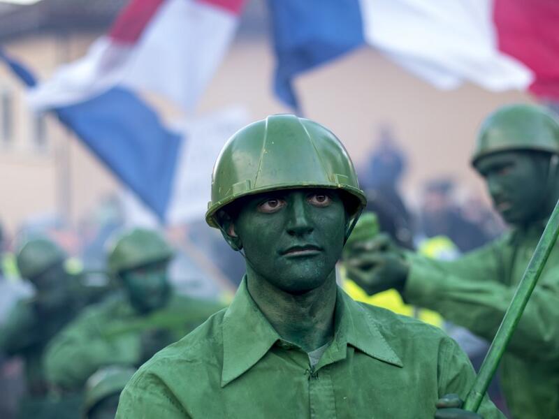 Masked revellers take part in a carnival procession through the south-western North Macedonian village of Vevcani, on January 13, 2020. The Vevcani carnival is 1.400 years old and is held every year on the eve of the feast of Saint Basil (January 14), which also marks the beginning of the New Year according to the Julian calendar, observed by the Macedonian Orthodox Church. Robert ATANASOVSKI / AFP