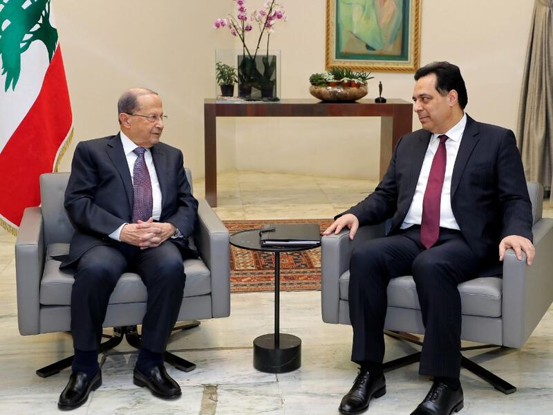 Lebanon's President Michel Aoun (L) meets with prime minister designate Hassan Diab at the presidential palace in Baabda, east of the capital Beirut, on January 21, 2020. AFP
