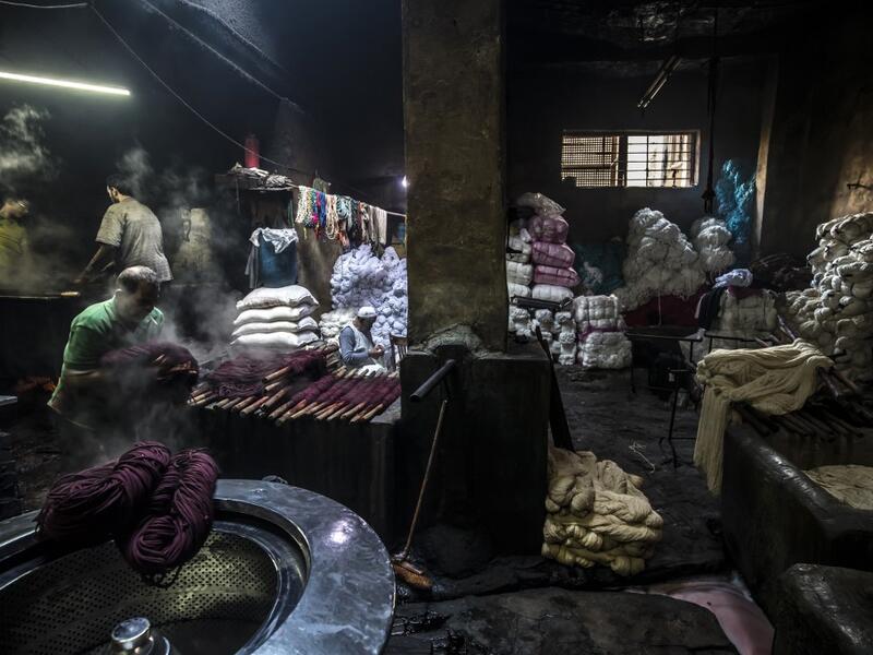 Salama and his relatives lay out the long, flowing threads, which will be used for everything from handmade shoes to rugs and drapes, and dip them in huge, piping-hot colour baths -- no gloves or masks protecting them from the dyes and chemical fumes. The workshop in Islamic Cairo has been going strong for over a hundred years. Khaled DESOUKI / AFP