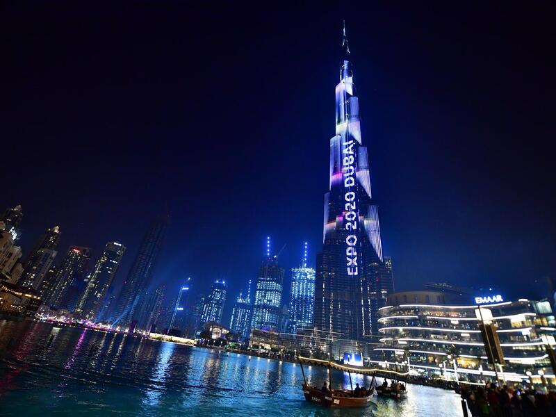 Dubai's Burj Khalifa, world's tallest building, is illuminated during festivities marking countdown to Expo 2020 (AFP)