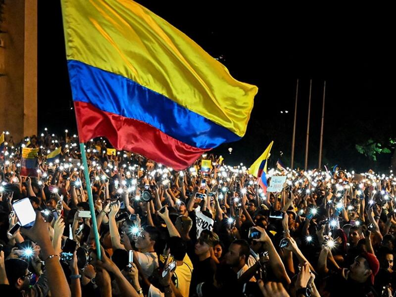 People take part in a protest against the government of Colombia's President Ivan Duque, in Cali, Colombia [Luis Yobayo/AFP] 