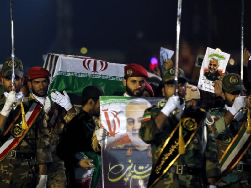 Military personnel carry the coffin of Iranian General Qasem Soleimani after his arrival at Ahvaz International Airport in southwestern Iran on January 5. Photo: Hossein Mersadi, AFP