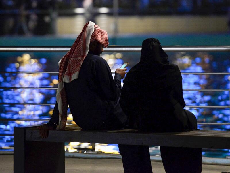 A picture taken on January 31, 2020 shows young Saudis gathering at the Riyadh Season Boulevard in the Saudi capital. In Saudi Arabia's rigid past, religious police once swooped down on rose sellers and anyone peddling red paraphernalia around Valentine's Day, but now a more open -- albeit risky -- dating culture is taking root. Pursuing relationships outside of marriage in the conservative Islamic kingdom once amounted to a death wish, and would-be Romeos resorted to pressing phone numbers up against their