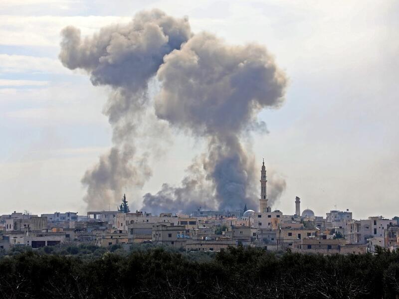 This picture taken on February 3, 2020 shows smoke plumes billowing in the Syrian village of al-Nayrab, about 14 kilometres southeast of the city of Idlib in the northwestern Idlib province, during bombardment by Syrian government forces and its allies. Omar HAJ KADOUR / AFP