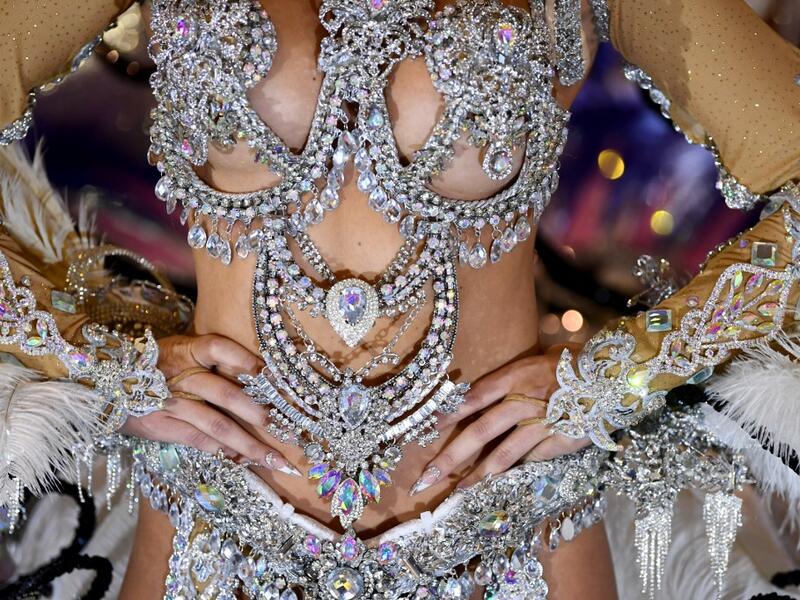 A participant prepares backstage before presenting her outfit during the Queen of the Carnival pageant contest in Santa Cruz de Tenerife, on the Spanish Canary island of Tenerife, on February 19, 2020. Gabriel BOUYS / AFP