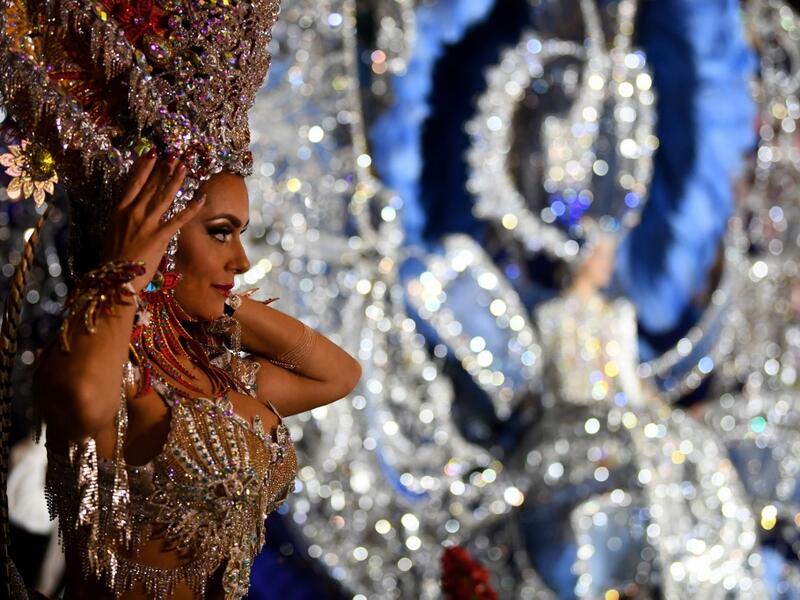 A participant prepares backstage before presenting her outfit during the Queen of the Carnival pageant contest in Santa Cruz de Tenerife, on the Spanish Canary island of Tenerife, on February 19, 2020. Gabriel BOUYS / AFP