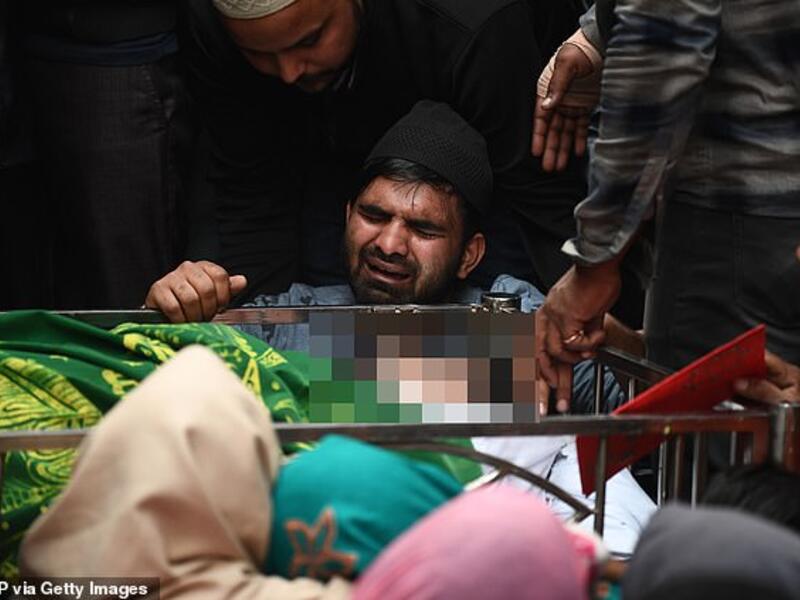 The brother (centre) of Mohammad MudAsir, 31, who died in the recent sectarian riots in India's capital over Prime Minister Narendra Modi's citizenship law, reacts during his brother's funeral in New Delhi today. AFP
