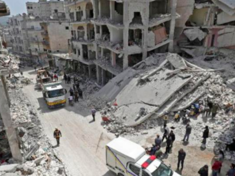 Members of the Syrian Civil Defense search the rubble of a collapsed building following an explosion in the town of Jisr al-Shughuor in Idlib, Syria on April 24, 2019. (AFP)