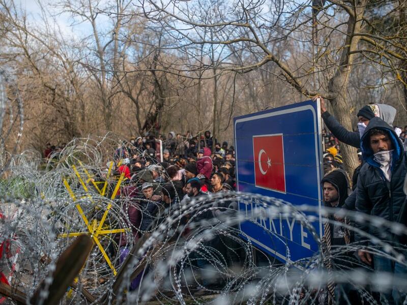 Greek police fired tear gas at migrants who have amassed at a border crossing in the western Turkish province of Edirne, some of whom responded by hurling stones at the officers. The clashes come as Greece bolsters its border after Ankara said it would no longer prevent refugees from crossing into Europe following the death of 33 Turkish troops in northern Syria. BULENT KILIC / AFP