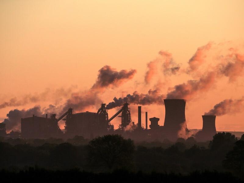In this file photo taken on May 22, 2019, vapour is pictured rising from British Steel's Scunthorpe plant at dawn in north Lincolnshire, north east England UK manufacturing activity rebounded in February to a ten-month high on easing Brexit uncertainty, but supply chains were nevertheless pressured by coronavirus concerns, data showed on March 2, 2020. The IHS Markit UK Manufacturing purchasing managers' index (PMI) stood at 51.7 last month, the group said in a statement. Lindsey Parnaby / AFP