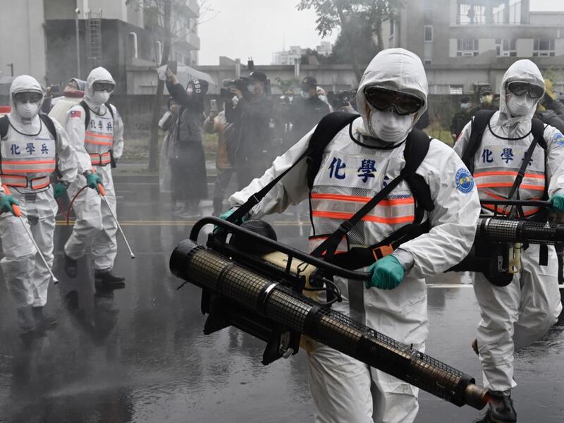 Soldiers from the military’s chemical units take part in a drill organised by the New Taipei City government to prevent the spread of the COVID-19 coronavirus, in Xindian district on March 14, 2020. Over 450 medical staff, community volunteers, government employees and military personnel took part in the drill. Despite being so close to the original outbreak in mainland China, Taiwan has just 48 confirmed cases of the Covid-19 disease with one death.  Sam Yeh / AFP